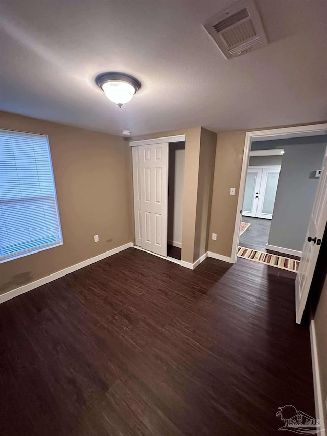 interior space with dark hardwood / wood-style floors