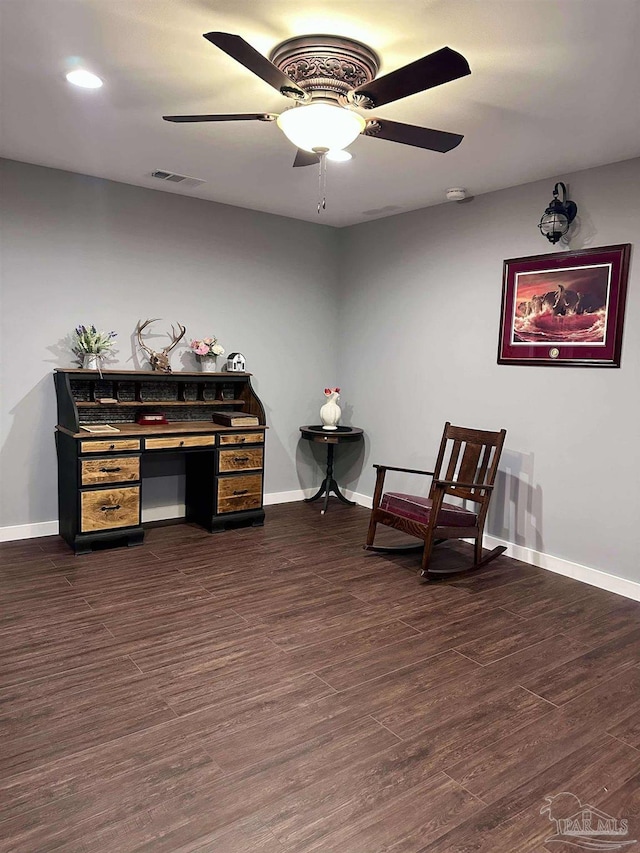 sitting room featuring dark hardwood / wood-style flooring and ceiling fan