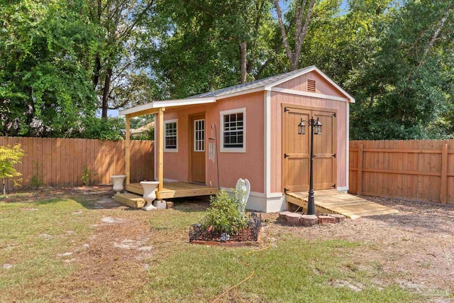 view of outbuilding featuring a lawn