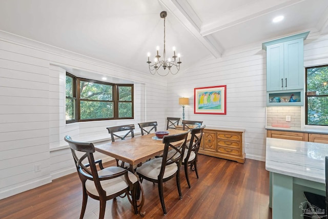 dining room featuring plenty of natural light, dark hardwood / wood-style floors, and an inviting chandelier