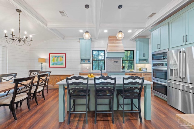 kitchen featuring a chandelier, pendant lighting, dark hardwood / wood-style flooring, and stainless steel appliances