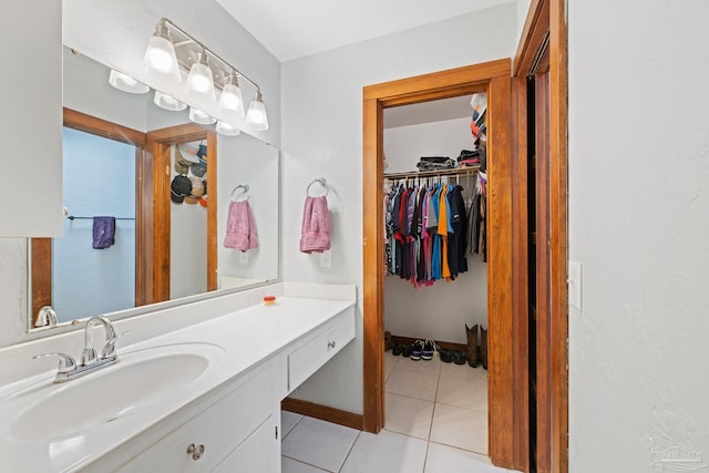 bathroom featuring tile patterned floors and vanity