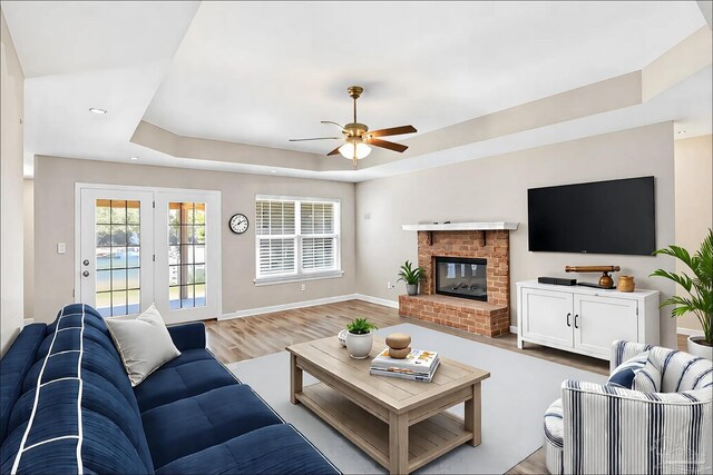 6459 E Quarry Dr, Elberta, AL 36530 - living area featuring a tray ceiling, a ceiling fan, light wood-style flooring, baseboards, and recessed lighting