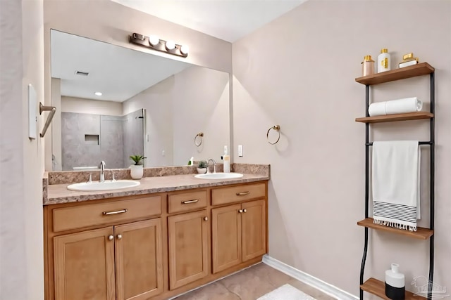 6459 E Quarry Dr, Elberta, AL 36530 - bathroom featuring double vanity, a shower, and baseboards