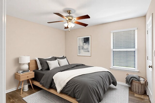 6459 E Quarry Dr, Elberta, AL 36530 - bedroom featuring baseboards, wood finished floors, and ceiling fan