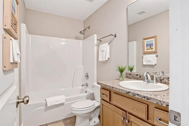 6459 E Quarry Dr, Elberta, AL 36530 - bathroom featuring vanity, washtub / shower combination, toilet, and tile patterned flooring