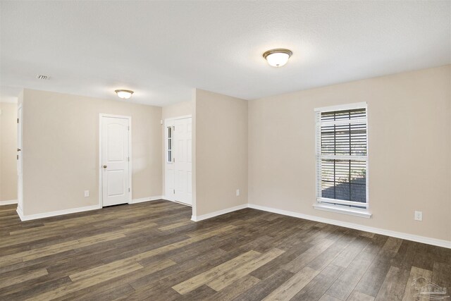 6459 E Quarry Dr, Elberta, AL 36530 - empty room featuring dark wood-style flooring and baseboards