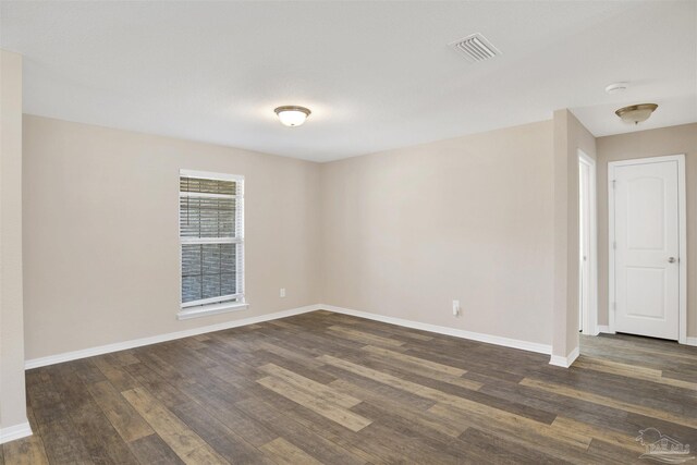 6459 E Quarry Dr, Elberta, AL 36530 - empty room with dark wood-style floors and baseboards