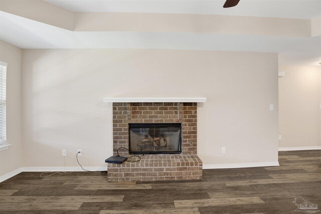 6459 E Quarry Dr, Elberta, AL 36530 - unfurnished living room featuring wood finished floors, a fireplace, baseboards, and a ceiling fan