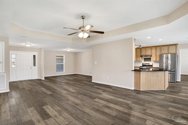 6459 E Quarry Dr, Elberta, AL 36530 - unfurnished living room with ceiling fan, dark wood-style flooring, baseboards, recessed lighting, and a raised ceiling