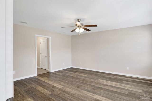 6459 E Quarry Dr, Elberta, AL 36530 - spare room featuring ceiling fan, dark wood-style floors, and baseboards