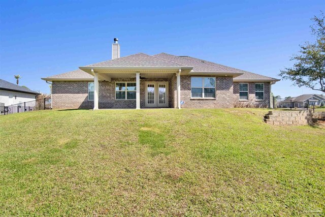6459 E Quarry Dr, Elberta, AL 36530 - back of property with a chimney, brick siding, french doors, and roof with shingles