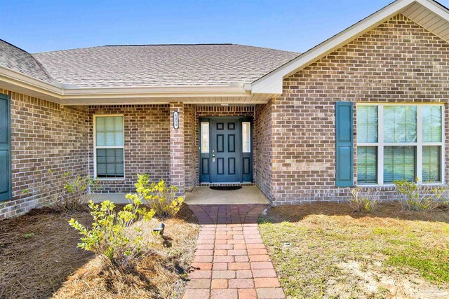 6459 E Quarry Dr, Elberta, AL 36530 - property entrance with brick siding and roof with shingles
