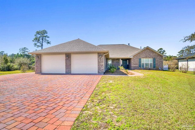 6459 E Quarry Dr, Elberta, AL 36530 - view of front of property featuring decorative driveway, an attached garage, brick siding, and a front lawn