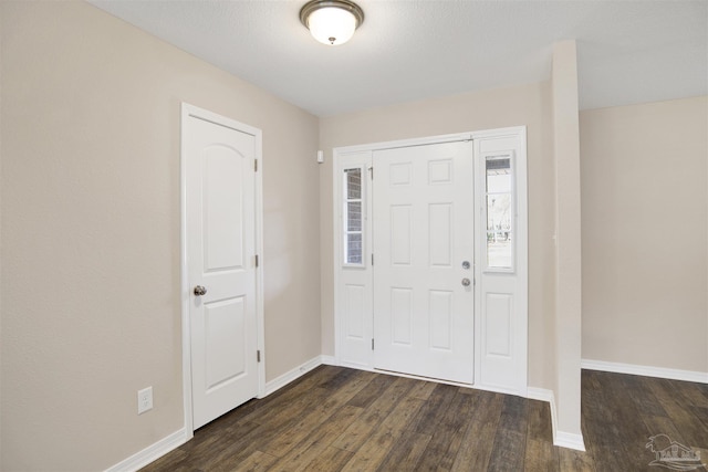 6459 E Quarry Dr, Elberta, AL 36530 - entryway featuring dark wood finished floors and baseboards