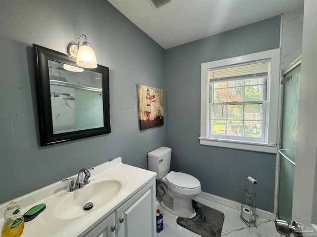 bathroom featuring vanity, toilet, and tile patterned flooring