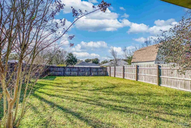 view of yard featuring a fenced backyard