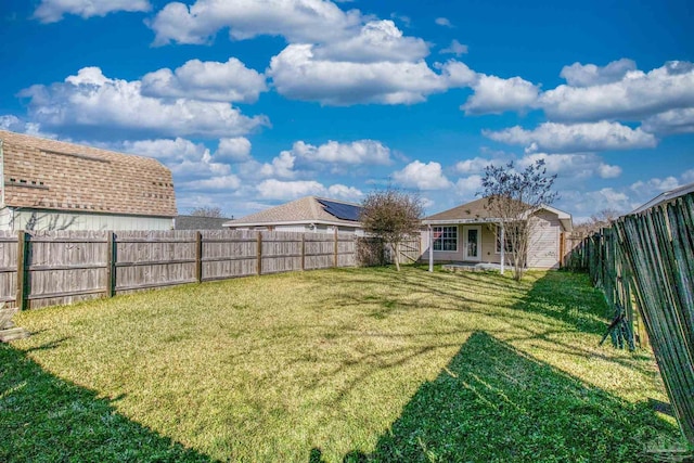 view of yard with a fenced backyard