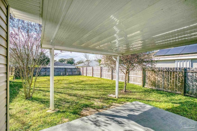 view of yard featuring a patio area and a fenced backyard