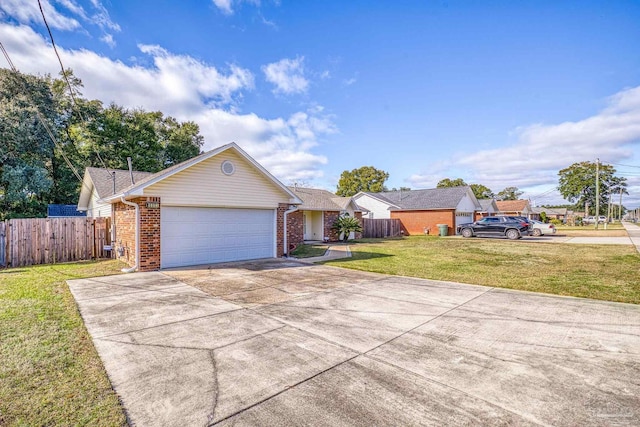 view of front facade with a garage and a front lawn