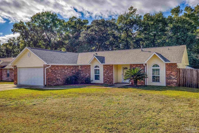 ranch-style house with a garage and a front lawn