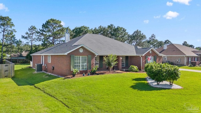 single story home with central air condition unit, a front yard, a chimney, and brick siding