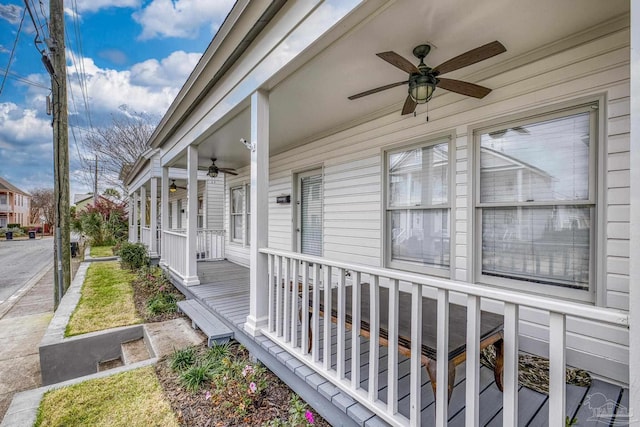 doorway to property featuring a ceiling fan and covered porch