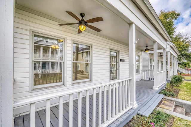 entrance to property featuring ceiling fan and a porch