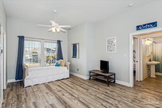 bedroom with hardwood / wood-style floors and ceiling fan