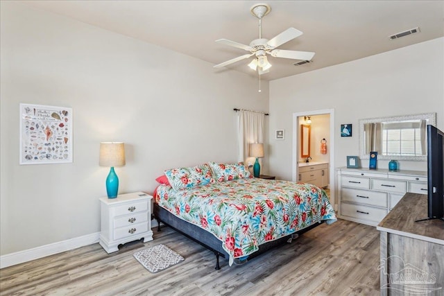 bedroom with ensuite bath, ceiling fan, and light wood-type flooring