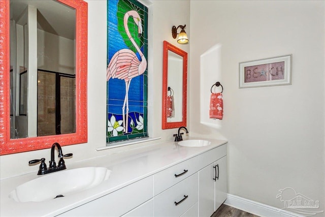 bathroom featuring vanity and hardwood / wood-style flooring