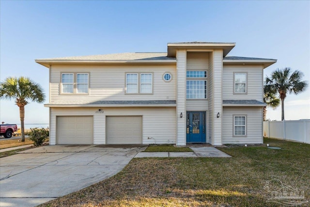 view of front facade with a garage and a front lawn