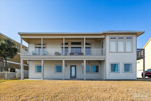 rear view of property with a yard