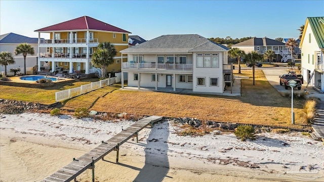 back of property featuring a balcony