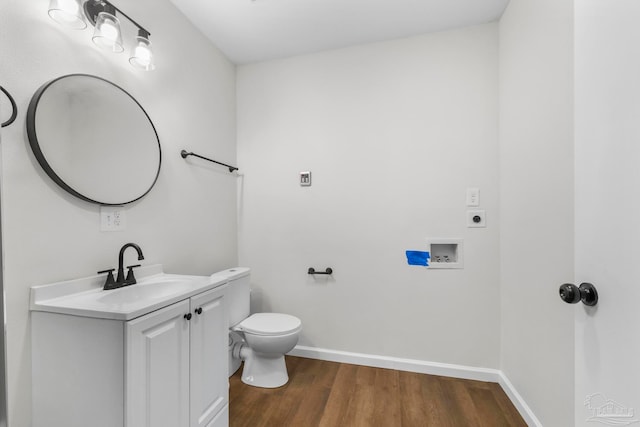 bathroom featuring vanity, toilet, and wood-type flooring