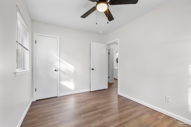 unfurnished bedroom featuring ceiling fan and hardwood / wood-style floors