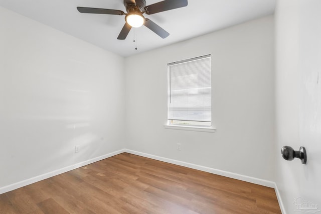 empty room featuring hardwood / wood-style floors and ceiling fan