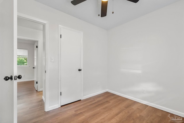 spare room featuring ceiling fan and light hardwood / wood-style floors