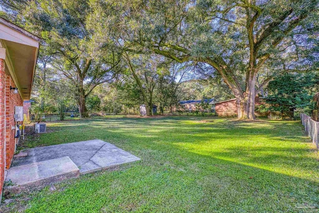 view of yard with a patio area and central AC unit