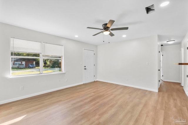 unfurnished room with ceiling fan and light hardwood / wood-style flooring