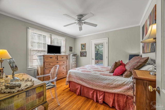 bedroom featuring access to exterior, light wood-type flooring, multiple windows, and ornamental molding