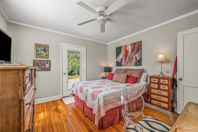 bedroom with light wood-style floors, ornamental molding, baseboards, and access to exterior
