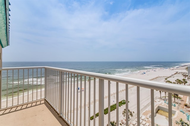 balcony with a beach view and a water view