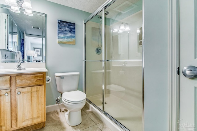 bathroom with toilet, a shower stall, vanity, a textured ceiling, and tile patterned flooring