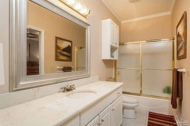 1424 Champions Green Dr, Gulf Breeze, FL 32563 - bathroom featuring vanity, tile patterned flooring, ornamental molding, toilet, and bath / shower combo with glass door