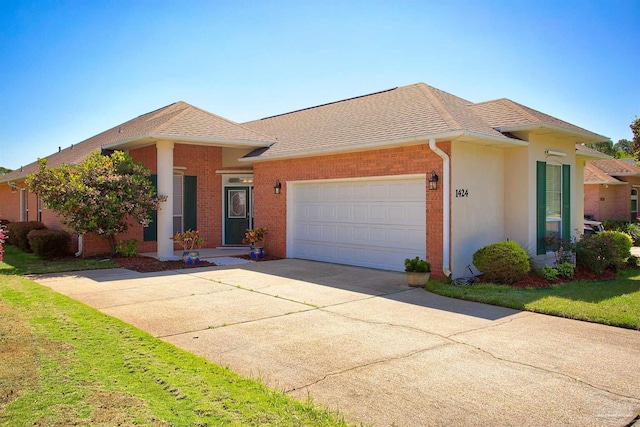 1424 Champions Green Dr, Gulf Breeze, FL 32563 - ranch-style home with concrete driveway, roof with shingles, brick siding, and an attached garage