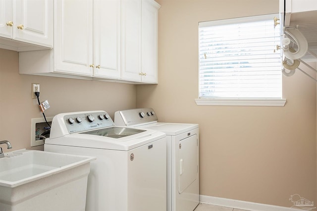 1424 Champions Green Dr, Gulf Breeze, FL 32563 - washroom featuring a sink, independent washer and dryer, cabinet space, and baseboards