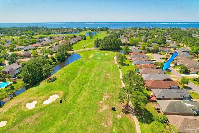 1424 Champions Green Dr, Gulf Breeze, FL 32563 - bird's eye view with golf course view, a residential view, and a water view