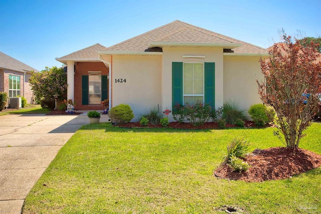 1424 Champions Green Dr, Gulf Breeze, FL 32563 - view of front of property with roof with shingles, stucco siding, driveway, a front yard, and central AC