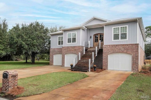 view of front of property with a garage and a front lawn